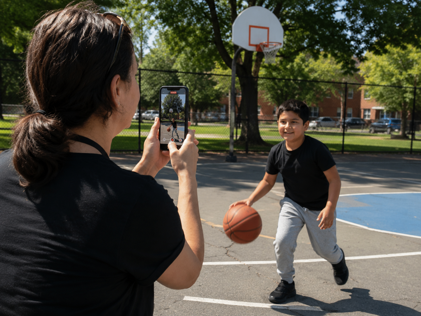 A caseworker recording a child playing basketball